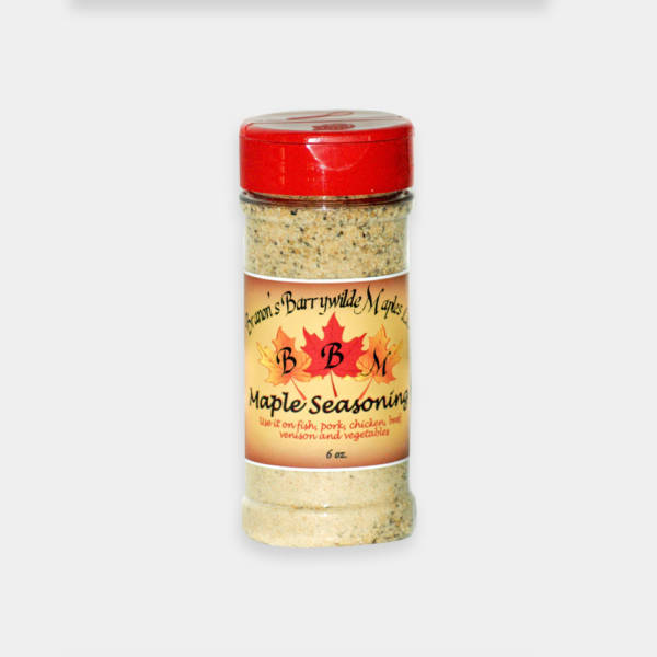 A jar of seasoning on top of a table.