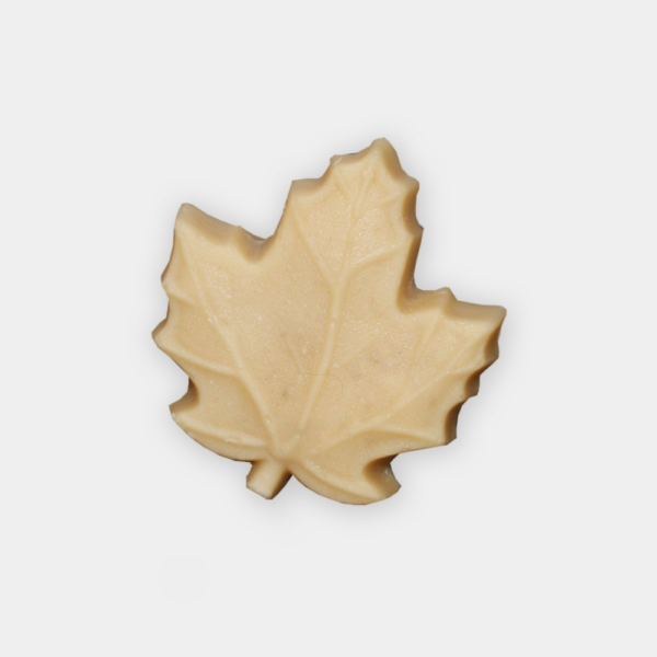 A maple leaf cookie is shown on top of a white background.